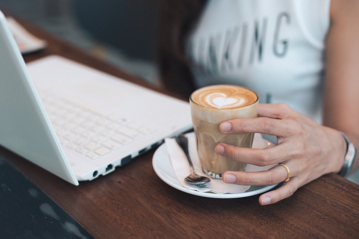 coffee latte art with woman hand